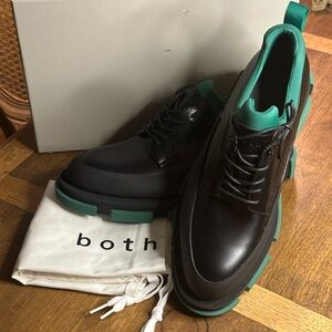 Black brogues with green and black lug soles